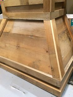 a large wooden box sitting on top of a table