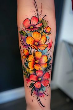 a colorful flower tattoo on the leg