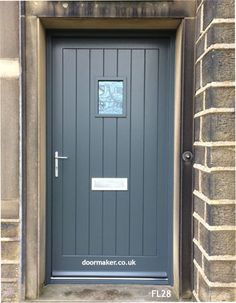 a grey door with a sign on it