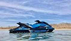 a blue and black jet ski is in the water