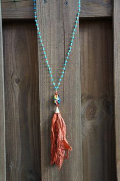 Blue Jade rosary chain, vintage marino glass bead with a silk tassel Bohemian Lariat Necklace With Tassels For Gifts, Bohemian Lariat Necklace With Tassels As Gift, Bohemian Tassel Necklace With Dangling Beads For Beach, Spiritual Beach Necklaces With Tassels, Blue Bohemian Hand Knotted Necklaces, Blue Bohemian Hand-knotted Necklaces, Bohemian Tassel Necklace With Beaded Chain, Bohemian Beaded Lariat Necklace With Tassels, Bohemian Lariat Beaded Necklace With Tassels