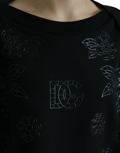 Indulge in the epitome of Italian elegance with this stunning Dolce & Gabbana black sweater. This luxurious pullover is adorned with sophisticated floral and logo appliques, presenting a chic and exclusive addition to your wardrobe. Crafted from a sumptuous blend of nylon and elastane, this piece provides a sleek silhouette and comfortable fit, perfect for any high-fashion ensemble. Produced with the brand’s hallmark high craftsmanship, this sweater is a testament to timeless style and quality. Luxury Women's Logo Sweatshirt, Luxury Fitted Tops With Floral Applique, Luxury Fitted Floral Applique Tops, Luxury Women's Tops With Logo Detail, Luxury Sweater With Logo Detail, Luxury Black Sweatshirt With Logo Detail, High Heel Stiefel, Italian Elegance, Round Neck Sweater