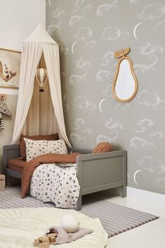 a child's bedroom decorated in neutral colors