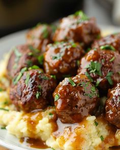 meatballs and mashed potatoes with gravy on a plate