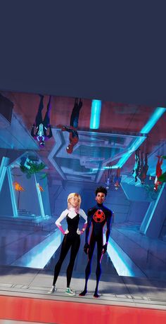 two people are standing on a stage in front of a screen with an animated scene behind them