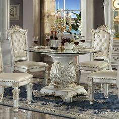 a dining room table with chairs around it