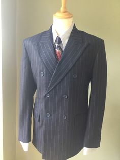 "An exact copy of post 1941 CC41 suit that is correct in every detail. This is made from 100%  wool in a beautiful flannel and is available as a three  piece suit. The suit jackets are available in sizes 40″ -50″  the 40″  jacket comes with  34\" trousers which can be let out or taken in  to a maximum of 2\" either way. The trousers then go up in 2\" sizes with the corresponding jacket 42\" jacket with 36\" trousers on so on to maximum of 42\" trousers. The trousers also come with an unfinished Semi-formal Striped Sport Coat With Notch Lapel, Winter Wool Pinstripe Outerwear, Pinstripe Wool Outerwear For Winter, Wool Pinstripe Outerwear For Winter, Winter Formal Pinstripe Outerwear, Winter Pinstripe Formal Outerwear, Tailored Striped Double-breasted Suits, Fitted Pinstripe Outerwear For Semi-formal Occasions, Striped Double Breasted Suit For Semi-formal Occasions