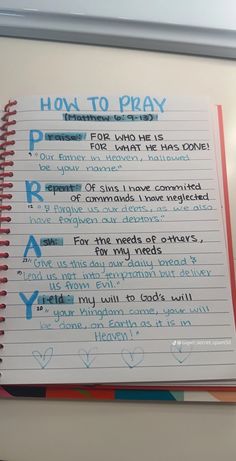 a notepad with writing on it that says how to pray and the words below it