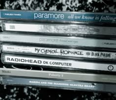 a stack of cds sitting on top of each other