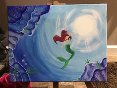 a painting of a little mermaid sitting on the edge of a cliff