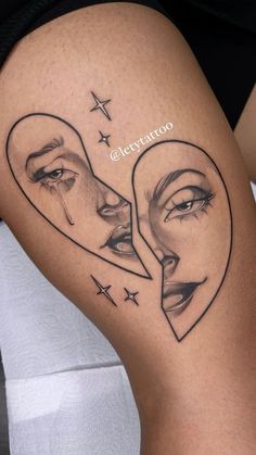 a woman's thigh with two faces in the shape of hearts and stars on it