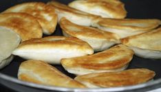 some food is cooking in a pan on the stove