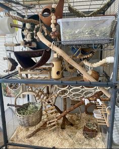 a bird cage filled with lots of different types of birds in it's cages