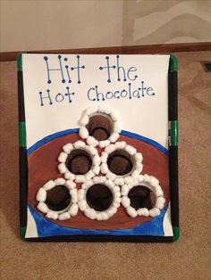 a book with chocolate candies in the shape of a football on it and writing hit the hot chocolate