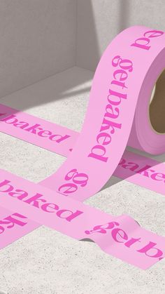 a roll of pink paper with the words dearest to be printed on it next to two rolls of pink tape