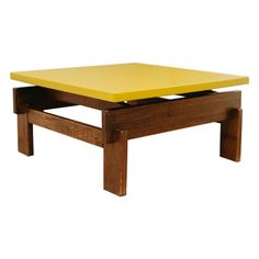 a wooden coffee table with a yellow top