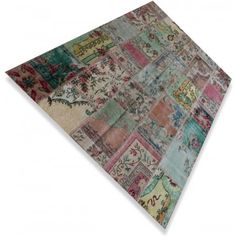 a multicolored patchwork rug on white background