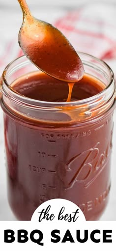 a spoon full of bbq sauce in a jar with the words, the best bbq sauce