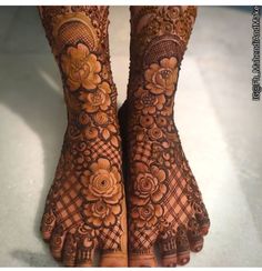 the feet are decorated with henna and flowers