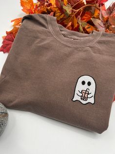 Introducing our Embroidered Boba Ghost Tee, a perfect blend of style and Halloween vibes! This Comfort Colors tee features a unique boba ghost embroidery that adds a touch of aesthetic charm to your wardrobe. With a nod to the spooky season and a playful coffee ghost design, this shirt is a must-have for those who love both fashion and Halloween. Whether you're a boba enthusiast, coffee lover, or just want to embrace the spooky spirit, this tee has got you covered. Elevate your casual look with this one-of-a-kind embroidered tee and let your personality shine through. Get ready to sip on style and embrace the Halloween fun with our Boba Ghost Tee!  All clothing and accessories from The Southern Thistle are handmade-to-order, just for you! ☺️  SIZING: Tshirts and sweatshirts are unisex, cla Spooky Season Clothes, Aesthetic Tshirts, Embroidery Aesthetic, Ghost Shirts, Ghost Embroidery, Crewneck Embroidery, Embroidery Shirts, Halloween Sewing, Ghost Tee