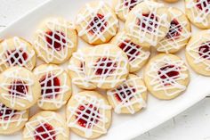 some cookies with icing on a white plate