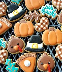 decorated cookies are arranged in the shape of turkeys and pumpkins