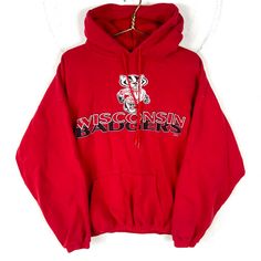 Vintage Wisconsin Badgers Sweatshirt Hoodie Extra Large Red Ncaa Size/Measurements (Based in inches) Size - XL Pit to pit - 28" Length - 26" Shoulder to cuff - 21.2" Condition / Details Vinyl cracking Stains on the right sleeve Pinhole on the back Seam separation on the front by the hood Combined Shipping: We provide combined shipping, please contact us for a quote Red Hooded Sports Top, Red Hooded Top For Sports Season, Collegiate Winter Top With Drawstring Hood, Collegiate Winter Tops With Drawstring Hood, Winter Fan Apparel Top With Drawstring Hood, Collegiate Red Sweatshirt For Sports Season, Red Sports Season Hoodie, Red Collegiate Sweatshirt For Sports Season, Red Varsity Hoodie For Streetwear