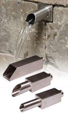 the faucet is connected to two stainless steel pipe holders with water running from them