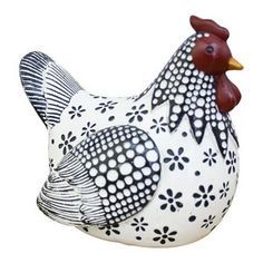 a black and white rooster statue on a white background