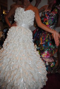 a woman in a white dress made out of plastic bottles