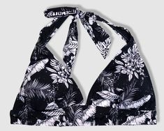 Tying bikini halter top - black with white tropical leaves pattern. Padding inserts included. TOP ONLY. Made of 80% nylon and 20% spandex. Lining is 100% nylon. Designed and shipped from Hawaii and made in Vietnam. Colors may vary from picture depending on cut of fabric. Tropical Print Halter Neck Top For Swimming, Tropical Black Triangle Top Swimwear, Hawaii Swimwear, Honolulu Oahu, Tropical Leaves Pattern, Blue Hibiscus, White Leaves, Two Piece Swimwear, Aesthetic Clothing