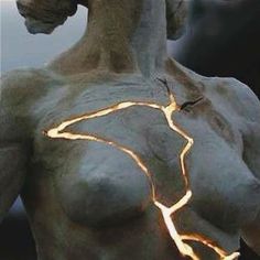 an image of a statue with lights on it's chest and arm, in the shape of a horse