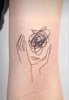 a woman's arm with an abstract tattoo on the left side of her body