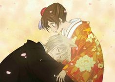 two people in kimonos hugging each other