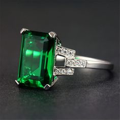 Set with a vibrant cubic zirconia and shimmering crystal accents, this elegant ring encircles your finger with sparkling charm. Hypoallergenic Face: 0.55'' W Silvertone copper / cubic zirconia / crystal Green Emerald Ring, Cushion Cut Ring, Silver Wedding Rings, Elegant Ring, Emerald Gemstone, Classic Ring, Emerald Ring, Types Of Rings, Womens Engagement Rings