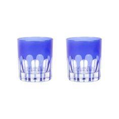 two blue glass cups sitting next to each other