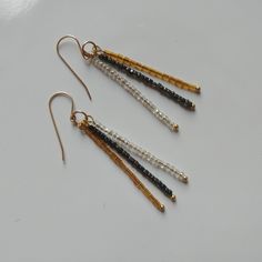 Simple yet elegant, beaded stick earrings made from clear, gunmetal and gold sparkly antique glass seed beads. On gold filled French ear wires. Total length approx 2". Comes in a small jewelry box. Stick Earrings, Craft Jewelry, Small Jewelry Box, French Wire, Small Jewelry, Antique Glass, Ear Wires, Jewelry Crafts, Favorite Jewelry