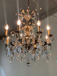 a chandelier hanging from the ceiling in a room