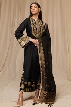 Editor's Note Unlock Your Glamour Quotient With This Black Raw Silk Kurta, Culotte & Dupatta. Kurta Is Adorned With Aari Embroidery And Placket Detail , Bell Sleeves Embellished With Em... Brocade Dupatta, Raw Silk Kurta, Caribbean Fashion, Blouse Yoke, Black Kurta, Shoulder Duster Earrings, Aari Embroidery, Silk Kurta, Lakme Fashion Week