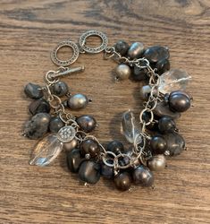 "Silpada Vintage Grey Pearl Hematite Shell and Chalcedony Bracelet with Double Toggle Clasp. Toggle Clasp Closure that can be adjusted. Adjustable from 7.5\" to 8.5\" Silpada B1777, Retired. Fits Approx. 7.5\" to 8.5\" wrist Sterling silver toggle clasp Silpada Beaded bracelet REF: \"Silpada Grey Pearl\" Bracelet" Elegant Metal Beaded Bracelets With Natural Stones, Silver Beaded Bracelets With Natural Stones And Dangle, Silver Beaded Bracelet With Natural Stones And Dangle, Elegant Dangle Bracelets With Natural Stones, Elegant Natural Stones Dangle Bracelet, Adjustable Beaded Bracelets With Toggle Clasp, Chip Bead Jewelry, Chalcedony Bracelet, Claw Earrings