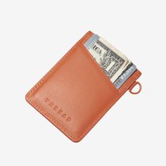 Our patented Vertical Wallet is a slim leather wallet equipped with our signature elastic pocket, which not only fits tightly around your cards but also gives the wallet a unique style. This Thread® wallet features RFID-secure technology to protect your credit card information. Everyday Orange Leather Wallet, Orange Rectangular Wallets With Interior Card Slots, Orange Leather Wallets With Interior Card Slots, Orange Wallet With Card Slots For Daily Use, Orange Leather Wallet With Card Slots, Thread Wallets, Slim Leather Wallet, Credit Card, Leather Wallet