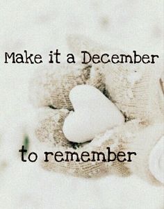 a white teddy bear sitting on top of a pile of blankets with the words make it a december to remember