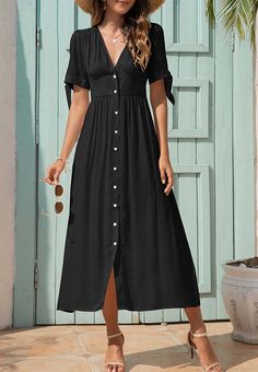 The EMES SHOP dress is detailed with fun tie sleeves. Features a v neck line. button down design. short sleeves. flowy dress. and mid-calf length. Pair it with sunnies and espadrilles for a magnificent summer look.MATERIALS: 91-99 % PolyesterMEASUREMENTS: Product length is 50"-51.9" 4-6-Small | Waist: 25-26.5 in | Chest: 33-34.5 in | Hips: 35-36.5 in 6-8-Medium | Waist: 26.5-28 in | Chest: 34.5-36 in | Hips: 36.5-38 in 8-10-Large | Waist: 28-29.5 in | Chest: 36-37.5 in | Hips: 38-39.5 in 10-12-X V-neck Midi Dress With Button Closure For Vacation, Casual Button-up Maxi Dress For Summer, Flowy Button-up Summer Maxi Dress, Flowy Button-up Maxi Dress For Summer, Casual Flowy Maxi Dress With Button Closure, Summer Button-up Maxi Dress, Casual Fitted Dress With Tie Sleeves, Flowy Summer Maxi Dress With Button Closure, Casual Summer Midi Dress With Button Closure