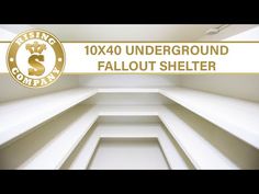 an empty room with white walls and gold lettering that reads 10x0 underground fault shelter