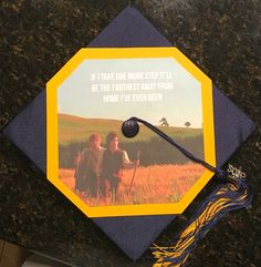 a graduation cap with the words it takes one more step to be the farthest away from home i've ever been