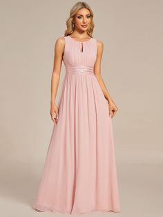 a woman wearing a long pink bridesmaid dress