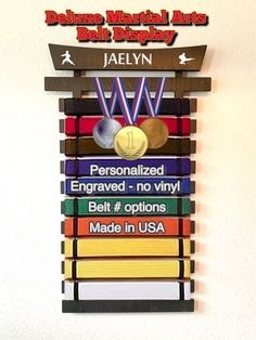 a plaque with medals on it that says doula's martial arts ball display