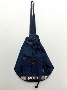 This bag is missing it's outer zipper pull tab, however the zipper itself is still functional. It also has some marks. (Please see photos for flaws) 12 inches x 13 inches Polo Ralph Lauren Faffia Bag, Uni Bag, Ralph Lauren Vintage, Flag Logo, Sling Bags, Polo Sport, Pull Tab, Cross Body Handbags, Purses And Handbags