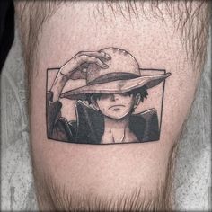 a man with a hat on his head is shown in black and white tattoo art