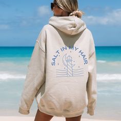 ✨ Step into comfort and style with my latest sweatshirt design! This hoodie is all about good summer vibes. A fun little expression to add a smile to your face. ✨ The design is laid-back and casual, perfect for those lazy days or casual outings. This unisex heavy blend hooded sweatshirt is cozy and comforting all in one. Made with a thick blend of fabrics, it feels plush and soft, a perfect choice. The front has a spacious pocket that adds convenience. Also includes a drawstring on the hood itself. ☀️ CARE INSTRUCTIONS☀️ ⚡️ Machine wash - warm (with like colors) ⚡️ Tumble dry - medium ⚡️ Do NOT dry clean ☀️ SIZING☀️ ⚡️ Unisex sizing ⚡️ Runs true to size ⚡️ Size up 2 sizes for oversized fit ☀️ FABRIC☀️ ⚡️ 50% cotton, 50% polyester ⚡️ Medium-heavy fabric Hooded Cotton Top For Vacation, Cotton Hooded Top For Vacation, Summer Vacation Cotton Hoodie, Vsco Letter Print Sweatshirt For Beach, Trendy Sweatshirt For Beach In Spring, Cotton Hoodie For Summer Vacation, Casual Beach Hoodie Top, Trendy Spring Beach Sweatshirt, Oversized Hooded Top For Vacation